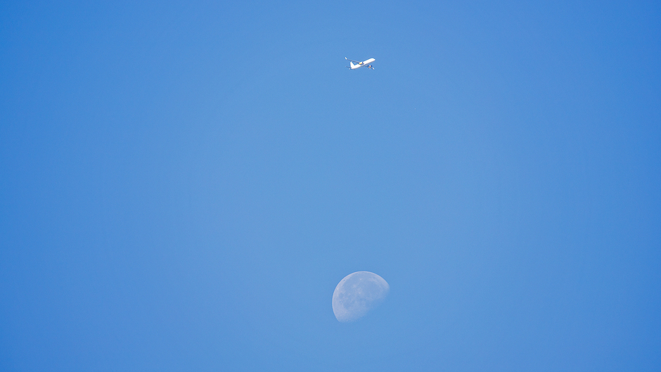 Plane over Moon