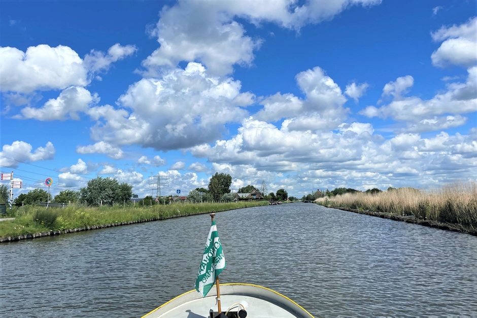 Stuifzand irisatie stapelwolken klaprozen Hollandse luchten polder
